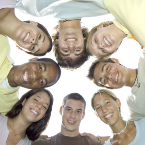 Teenagers Smiling in Group Hug